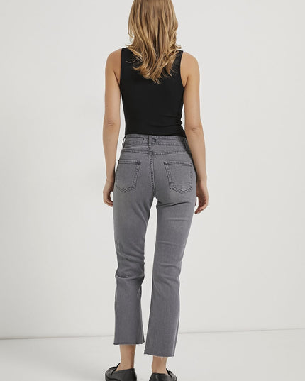 Flexible women's trousers with adjustable cut length