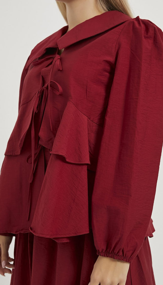 Damenbluse mit Rüschenlagen und Schleifendetails