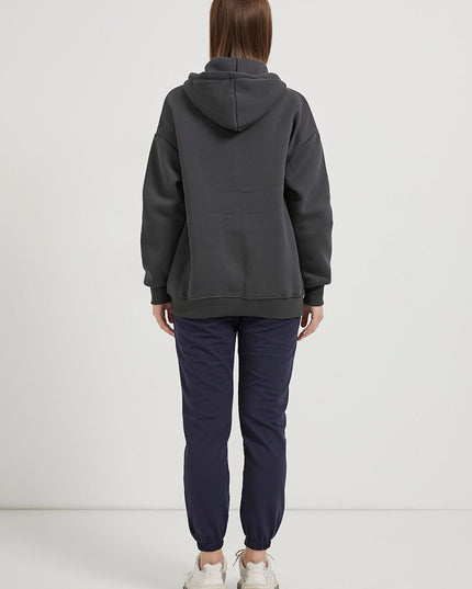 Übergrosser Damenpullover mit Kapuze, Reissverschluss und Riemchen